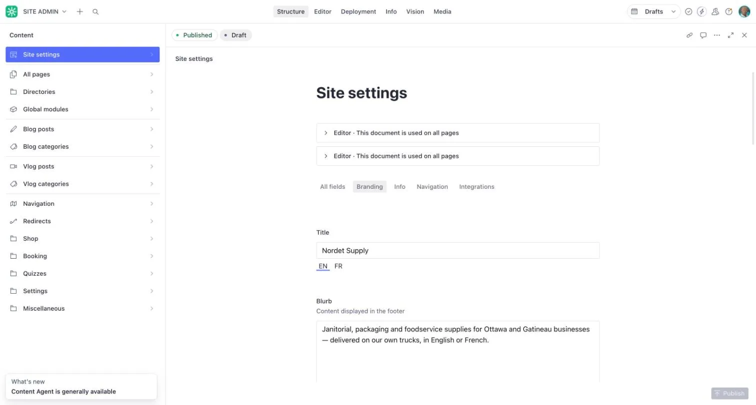 Site settings with the business name field and its EN and FR switch